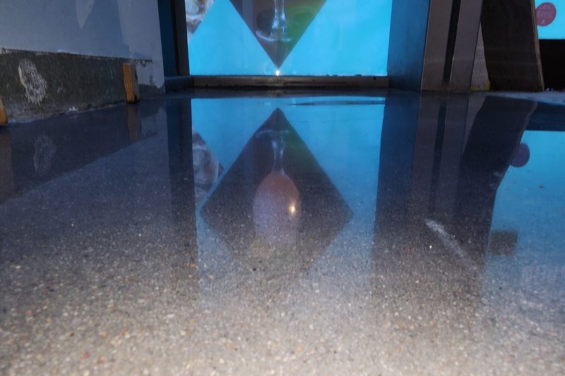 Reflective polished concrete floor in a commercial Colorado space