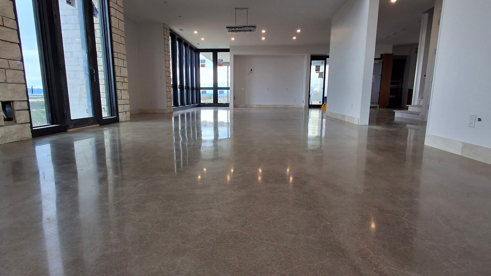 Reflective polished concrete floor in a bright Colorado great room