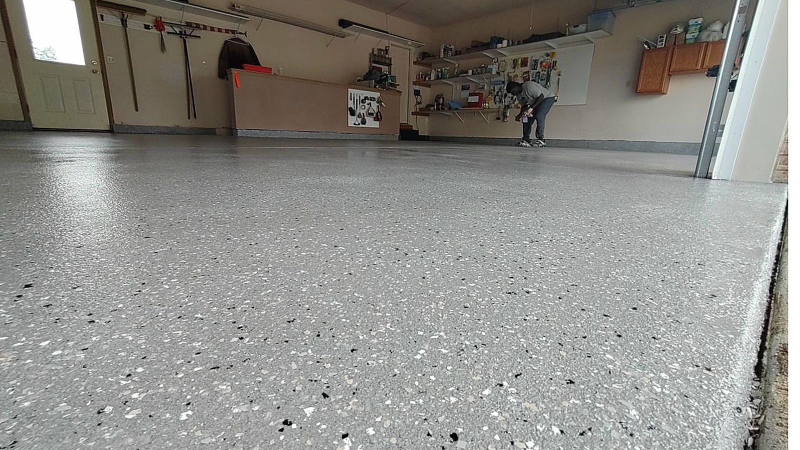 High-gloss coated garage floor with a mirror-like reflective finish in Colorado