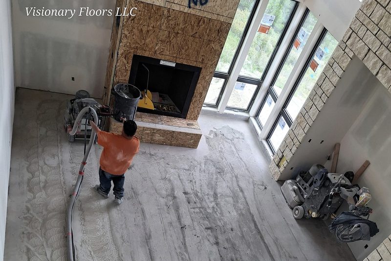 Concrete floor being prepped and stripped of an old coating in Colorado