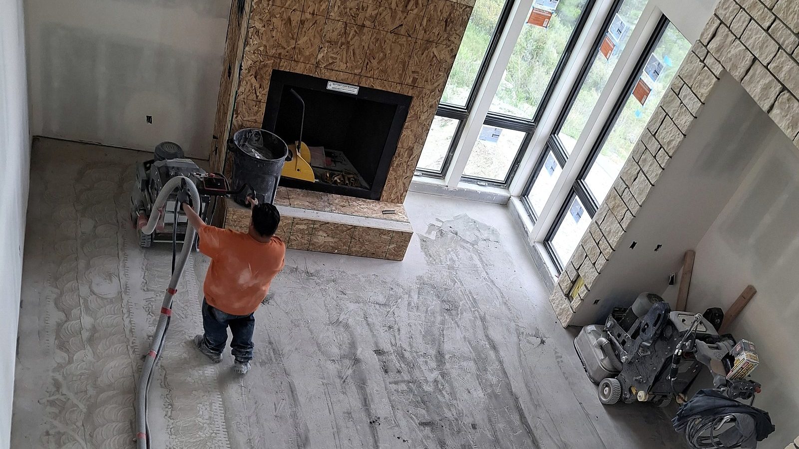 Concrete floor being prepped and stripped of an old coating in Colorado