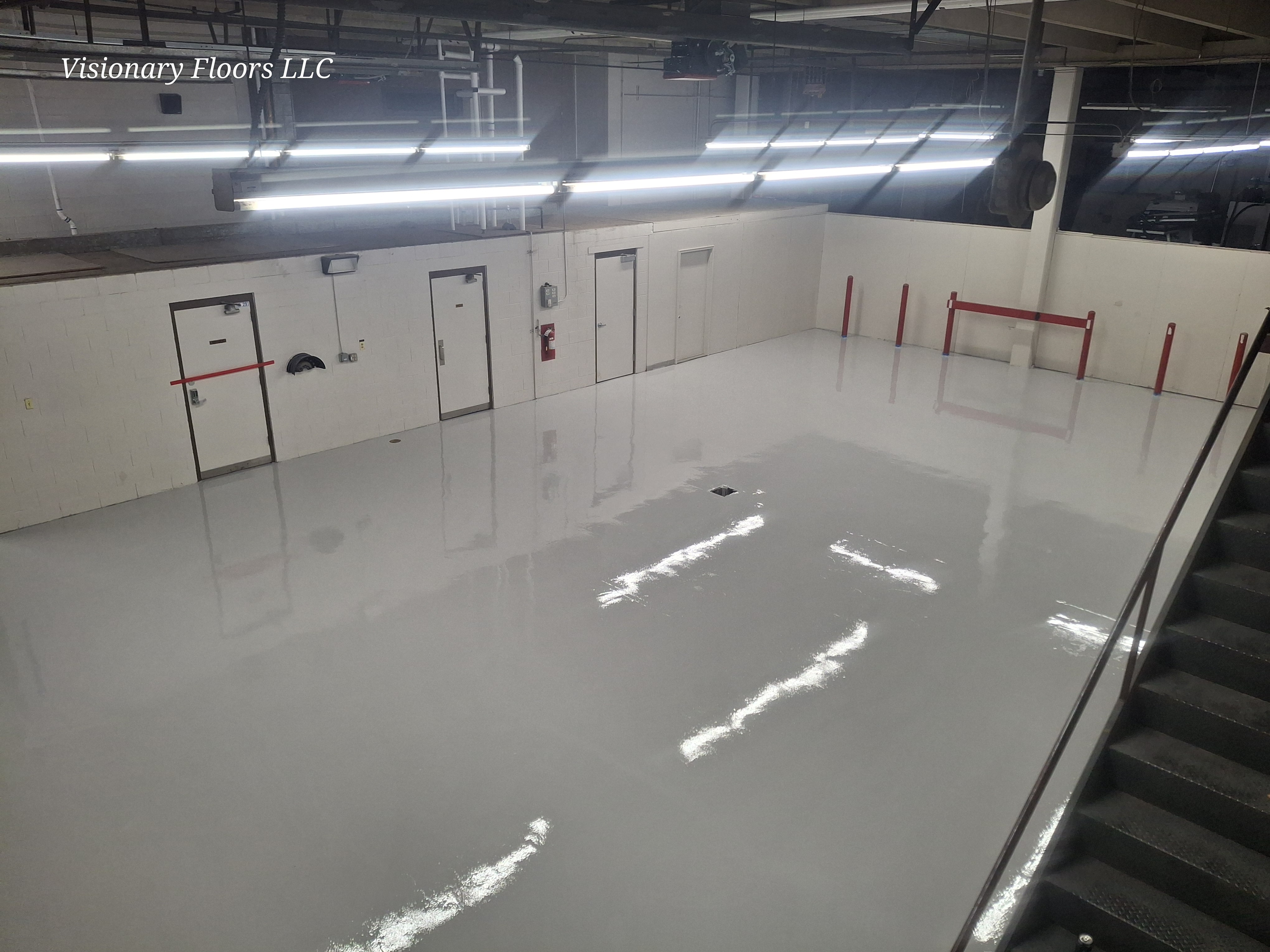White epoxy floor coating in industrial commercial basement — epoxy flooring contractor Denver CO