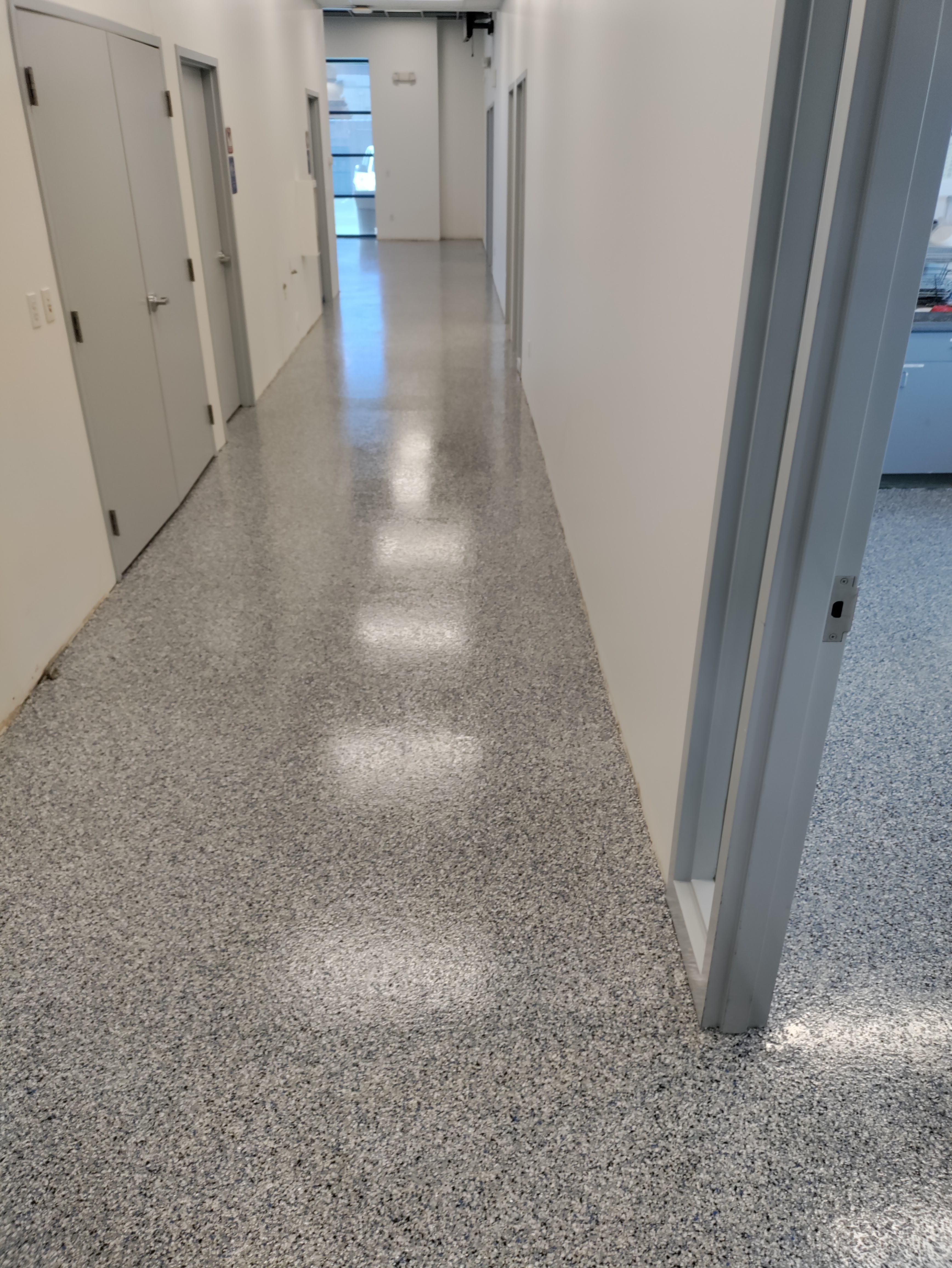 Flake epoxy hallway with high-gloss urethane topcoat in commercial building — flake epoxy contractor