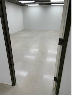 Commercial space with freshly coated epoxy floor reflecting lights