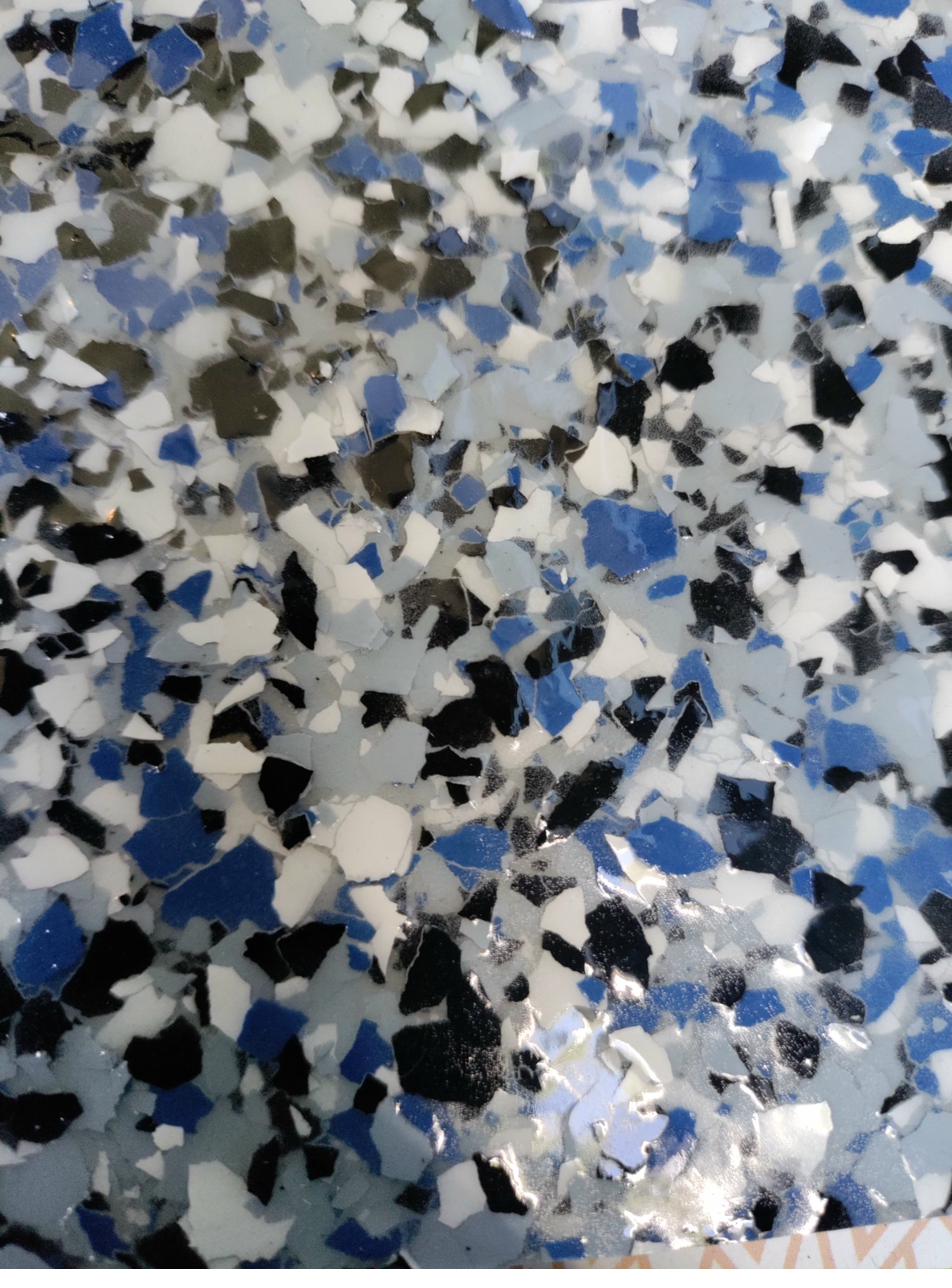 Decorative flake epoxy floor chip pattern closeup Denver CO