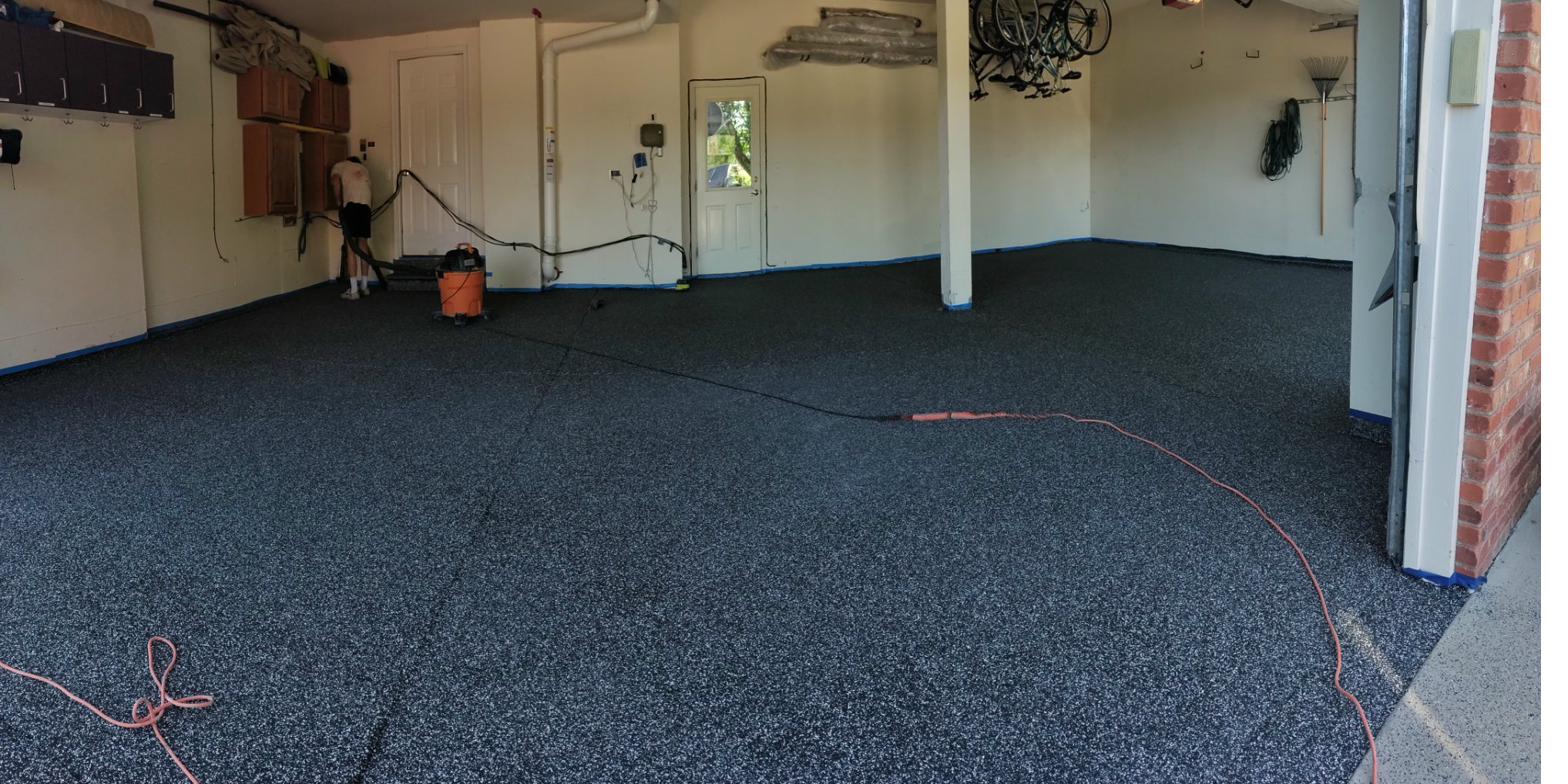Full-broadcast flake epoxy in two-car garage Thornton CO