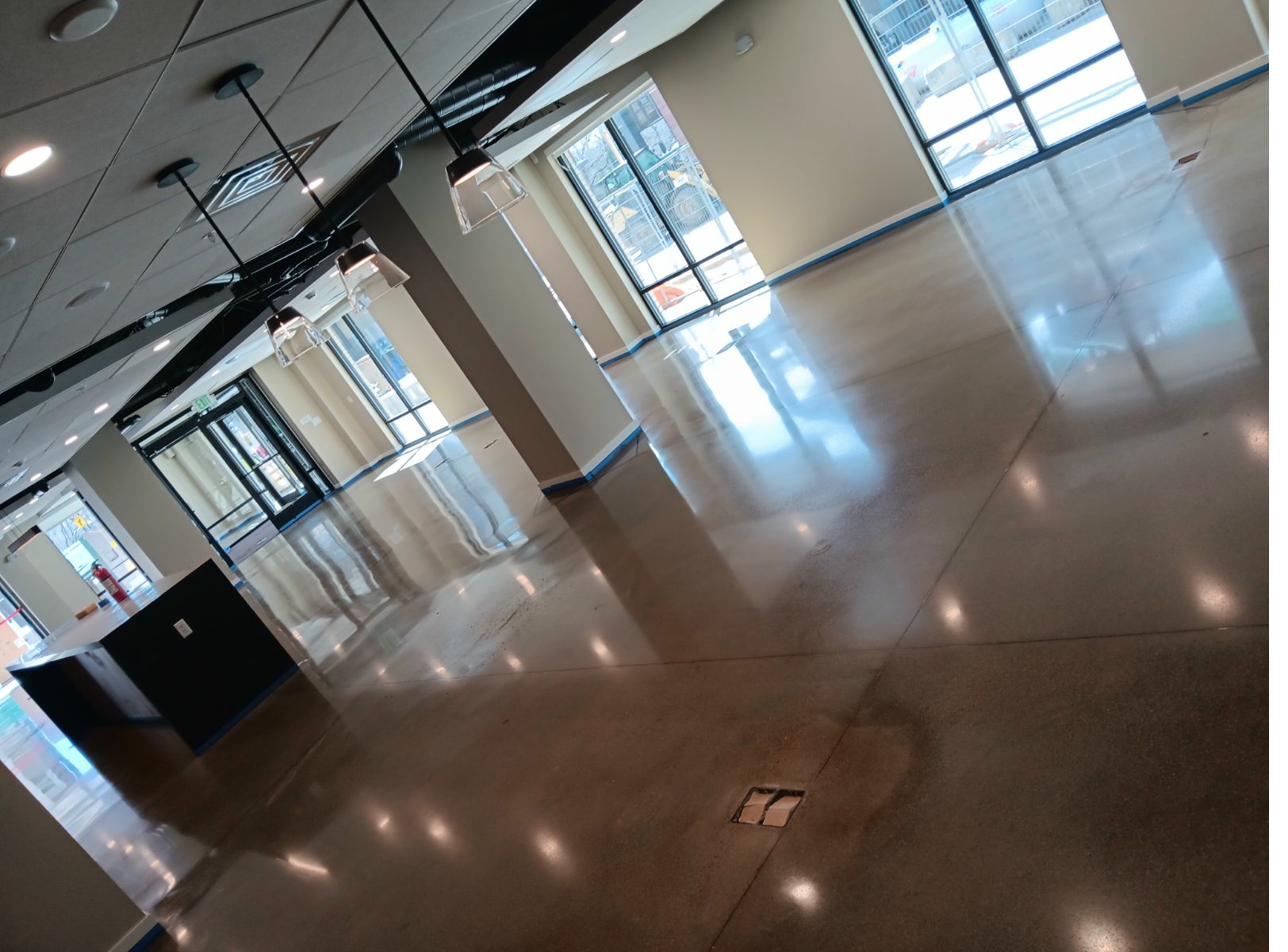 Finished high-gloss polished concrete floor with mirror reflections in a Colorado commercial space