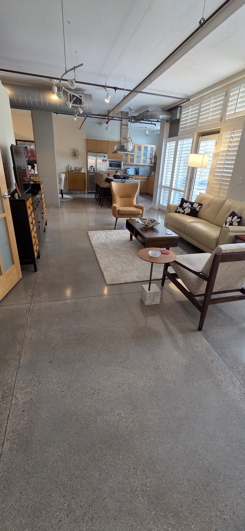 Open-plan polished concrete floors in modern loft — Colorado