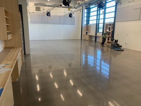 Diamond grinding machine preparing a concrete floor in a Denver commercial space