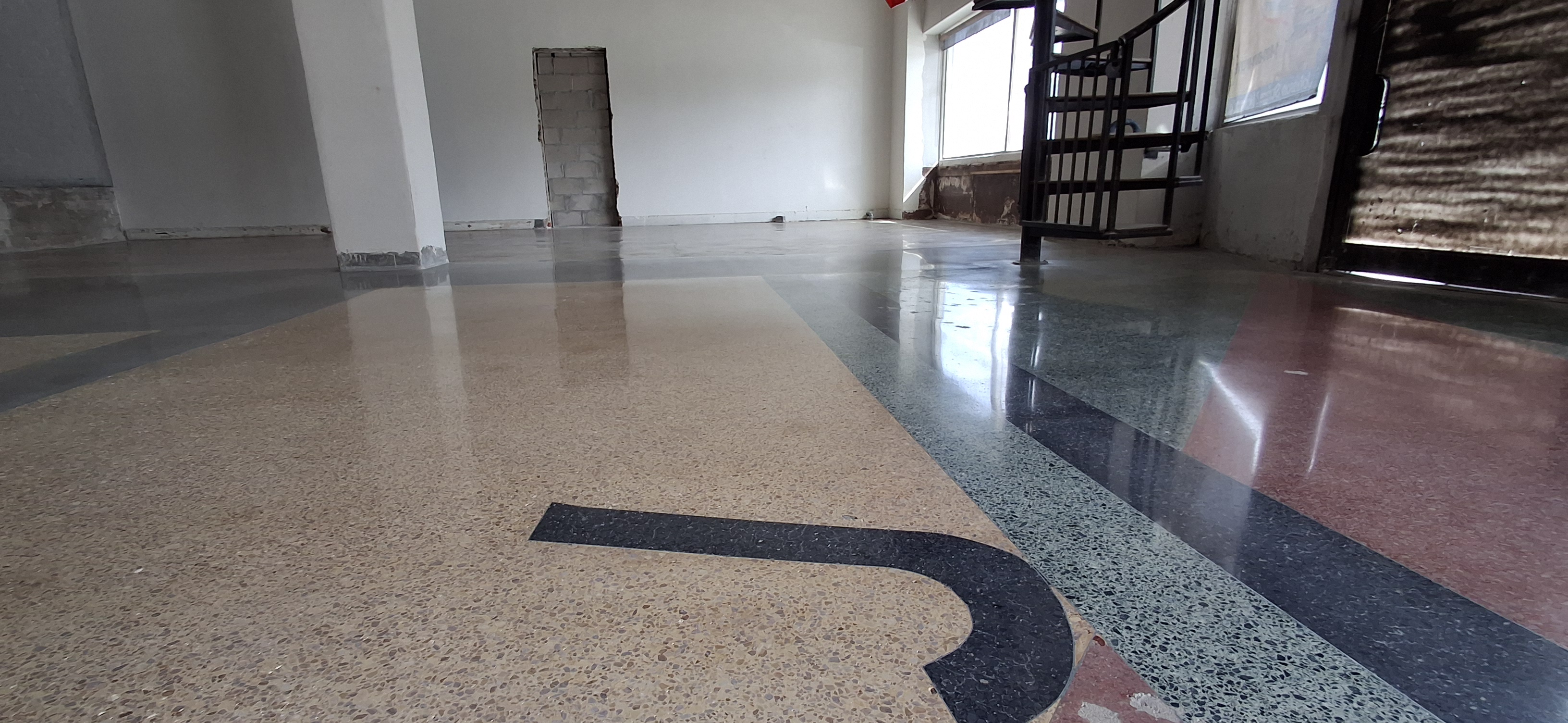 Decorative polished terrazzo floor with colored aggregate and floor number markings
