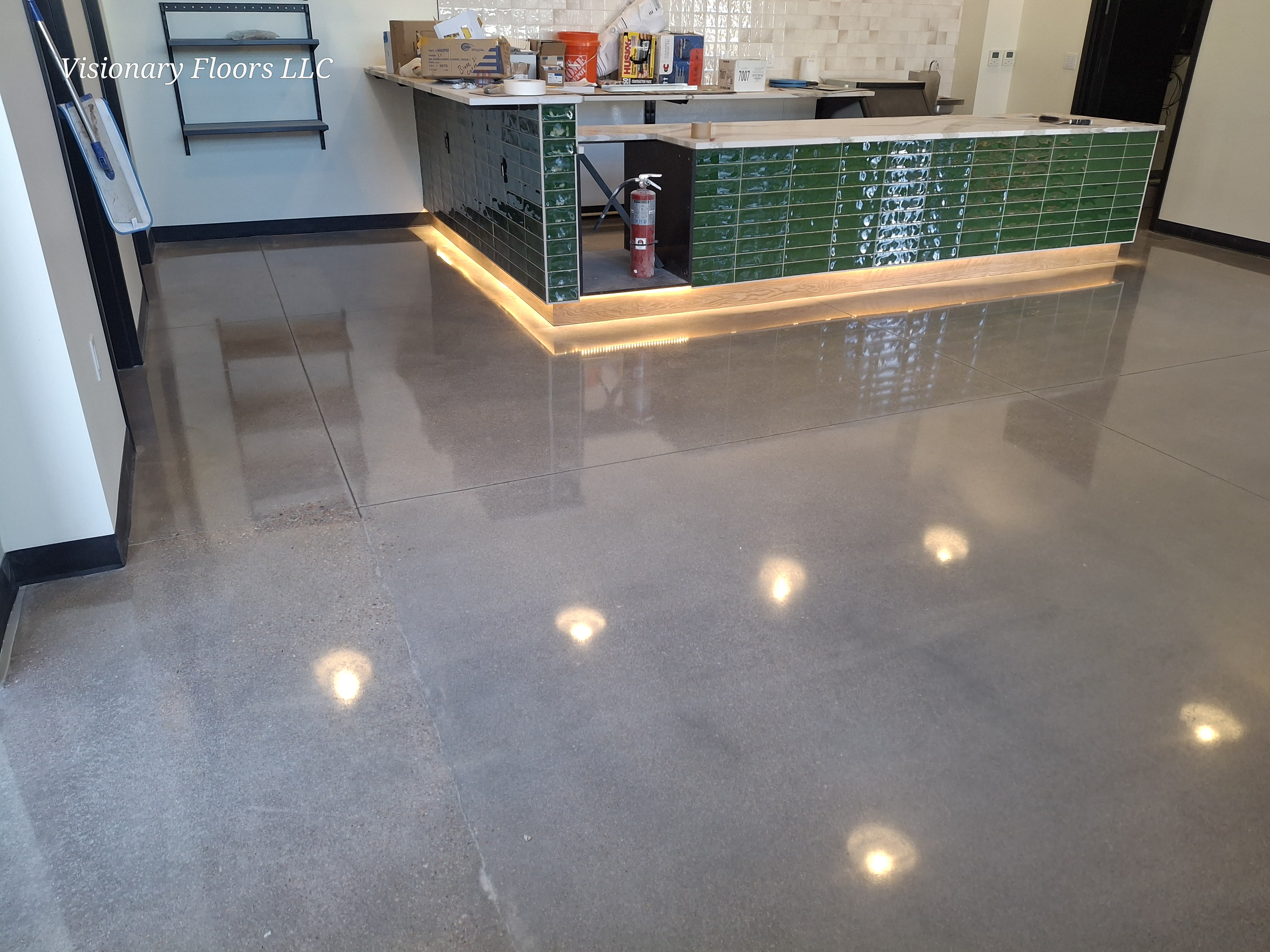 Polished concrete floor with mirror finish and under-counter lighting — polished concrete contractor Denver CO