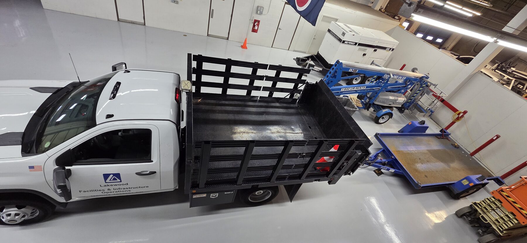 Overhead view of seamless gray traffic coating in municipal fleet garage — commercial traffic coatings Denver CO