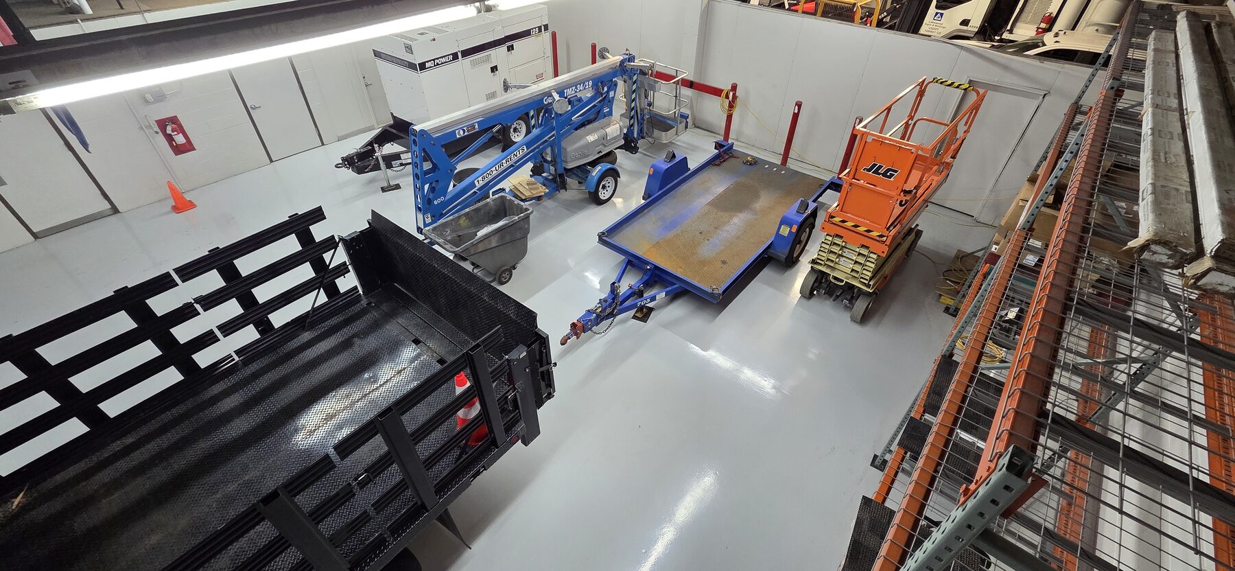 Overhead view of traffic coating spanning a municipal equipment and trailer storage bay — traffic coatings Colorado